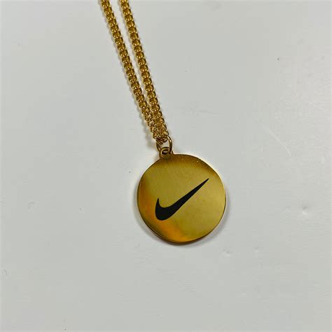 Gold nike anhänger 